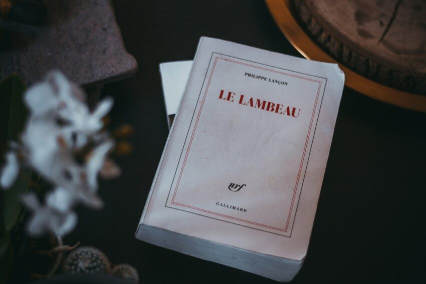 white Le Labeau book in a black surface close-up photography